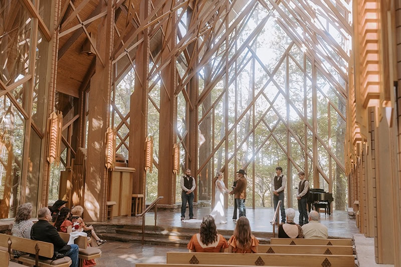A couple stands at the altar inside of Anthony Chapel for their elopement in Hot Springs, Arkansas.