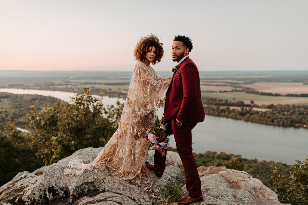 A bride and groom pose for a photo during their Arkansas elopement at Petit Jean State Park.