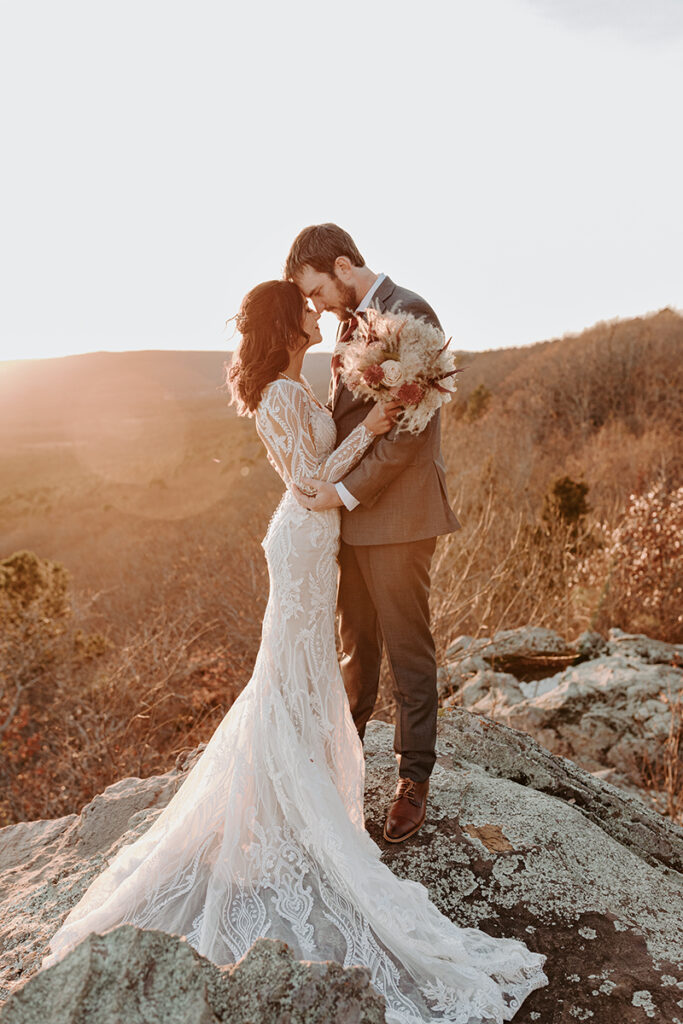 A bride and groom embrace during their Arkansas elopement at Petit Jean State Park.