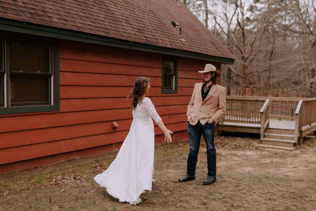 A bride shows her brother her dress before her Mt. Nebo wedding.