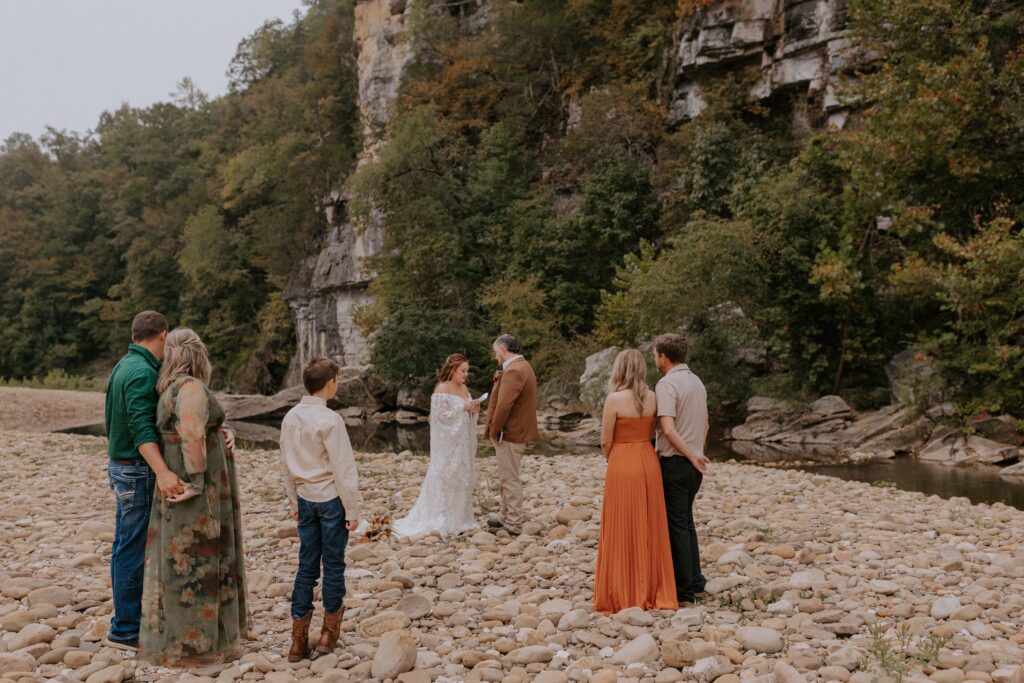 A couple reads their vows during their wedding ceremony at Steel Creek Campground.